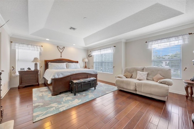 14231 Sonco Ave, Windermere, FL 34786 - bedroom with a raised ceiling, multiple windows, wood finished floors, ornamental molding, and baseboards