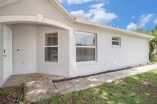 3319 Thistledown Ln, Land O Lakes, FL 34638 - view of property exterior with stucco siding