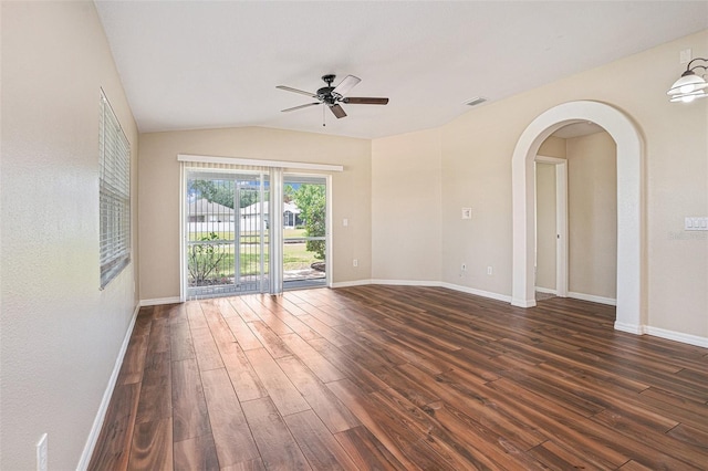 3319 Thistledown Ln, Land O Lakes, FL 34638 - empty room with ceiling fan, dark wood-type flooring, arched walkways, baseboards, and vaulted ceiling