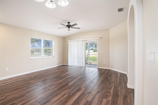3319 Thistledown Ln, Land O Lakes, FL 34638 - spare room with dark wood-style flooring, baseboards, a ceiling fan, arched walkways, and lofted ceiling