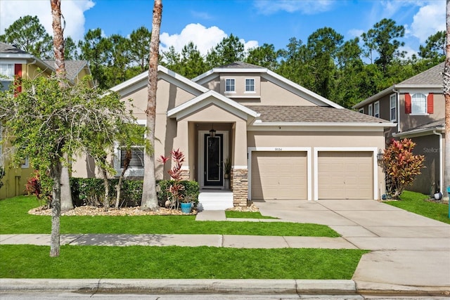 craftsman-style house with a garage, stucco siding, a shingled roof, concrete driveway, and a front lawn