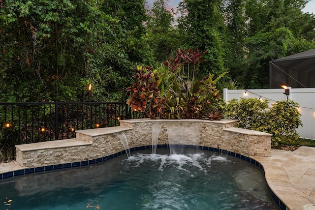 view of pool featuring a hot tub, a fenced in pool, and fence