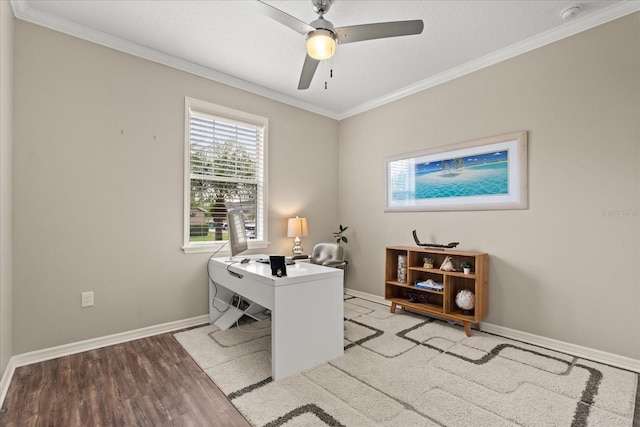 office area featuring baseboards, ceiling fan, light wood-type flooring, and crown molding
