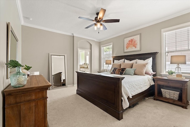 bedroom featuring ornamental molding, light carpet, and ceiling fan