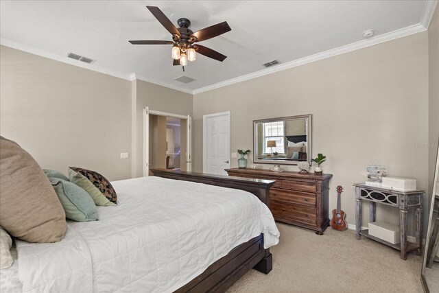 bedroom featuring light colored carpet, visible vents, a ceiling fan, and ornamental molding