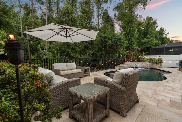view of patio / terrace with an outdoor living space and a fenced in pool