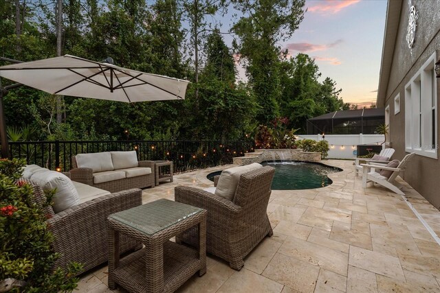 view of patio / terrace featuring an outdoor hangout area, a fenced in pool, and fence
