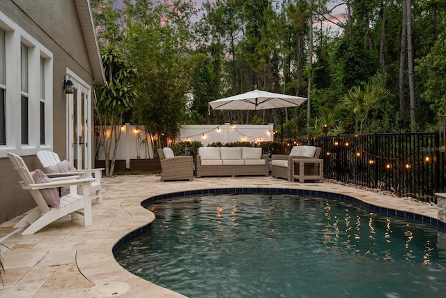 view of pool featuring a fenced backyard, a patio, and an outdoor hangout area