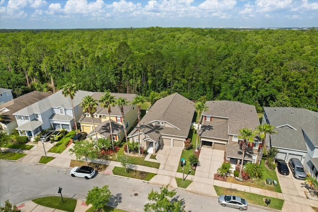 aerial view of residential area with a forest