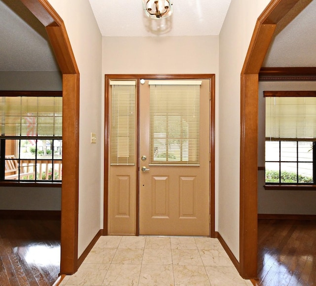 entrance foyer featuring baseboards