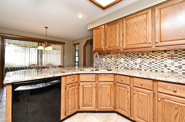 kitchen featuring black dishwasher, a sink, backsplash, and a peninsula
