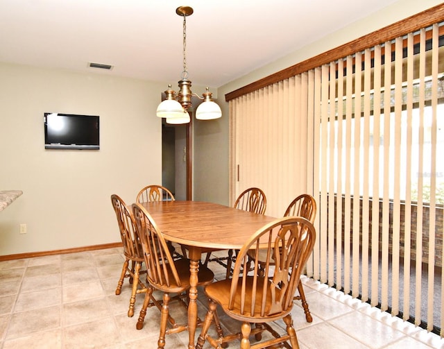 dining room with baseboards