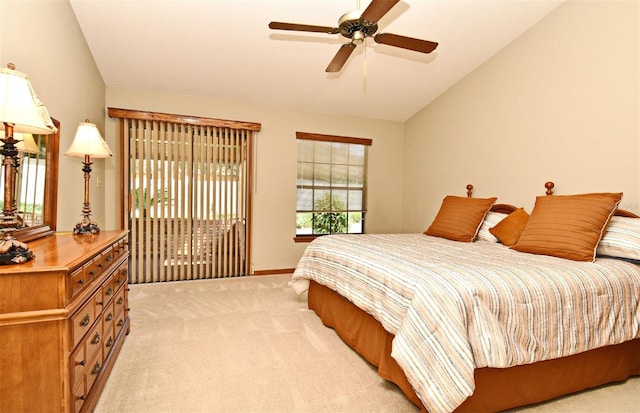 bedroom featuring light carpet, vaulted ceiling, baseboards, and a ceiling fan