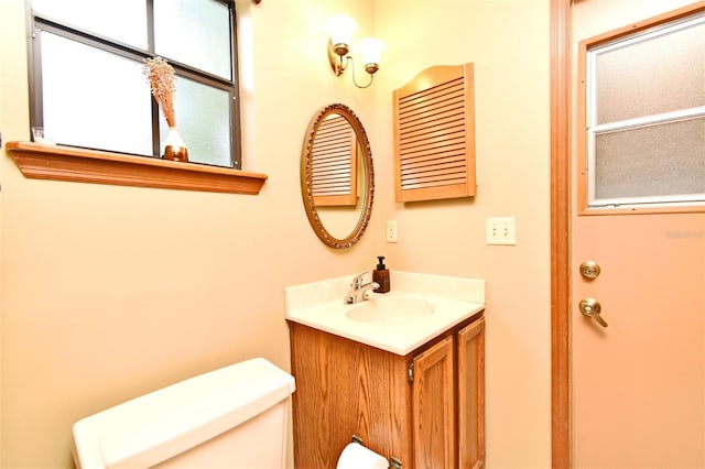 bathroom with vanity and toilet