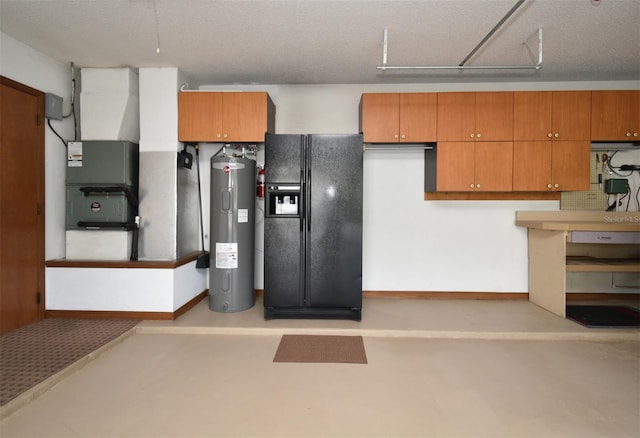 utility room with electric water heater and a garage