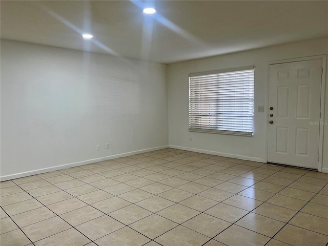 315 Lakepointe Dr Unit 101, Altamonte Springs, FL 32701 - empty room featuring light tile patterned floors and baseboards