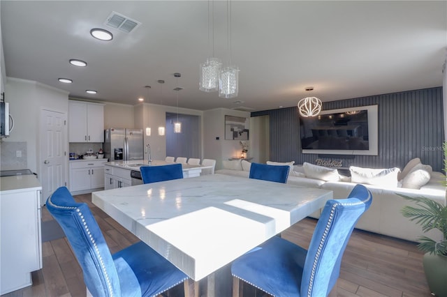 719 Tortugas St, Haines City, FL 33844 - dining space featuring wood finished floors and recessed lighting