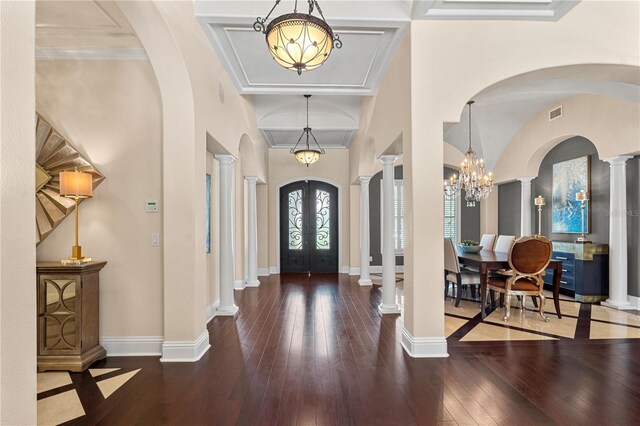 5909 Oxford Moor Blvd, Windermere, FL 34786 - foyer featuring arched walkways, hardwood / wood-style flooring, french doors, a chandelier, and baseboards