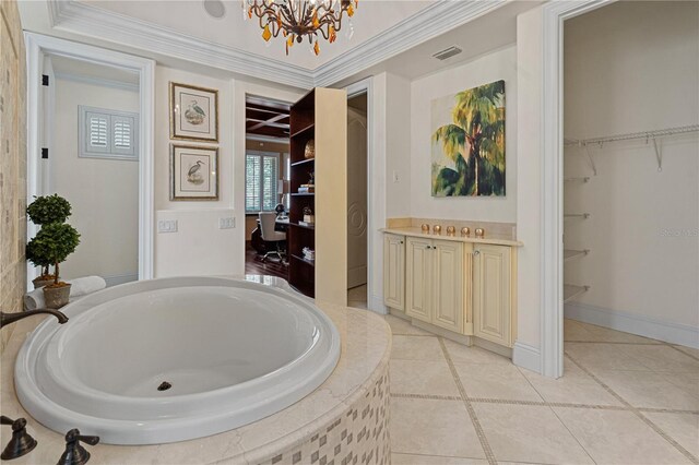 5909 Oxford Moor Blvd, Windermere, FL 34786 - bathroom featuring a chandelier, a bath, ornamental molding, and tile patterned floors