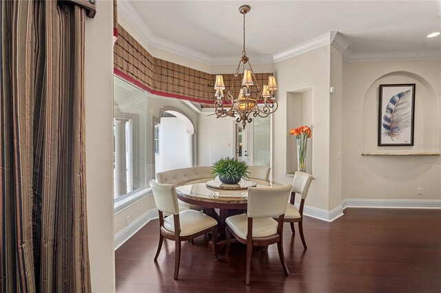 5909 Oxford Moor Blvd, Windermere, FL 34786 - dining area featuring baseboards, a chandelier, dark wood-style floors, and crown molding