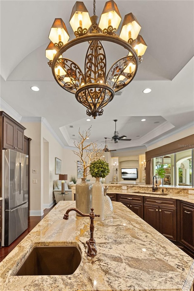 5909 Oxford Moor Blvd, Windermere, FL 34786 - kitchen with freestanding refrigerator, a sink, open floor plan, recessed lighting, and ornamental molding