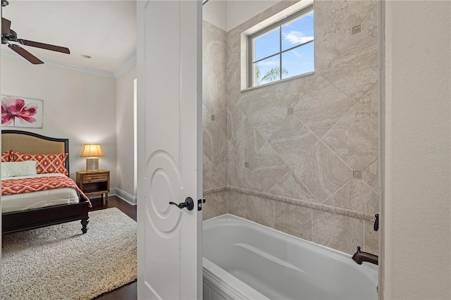 5909 Oxford Moor Blvd, Windermere, FL 34786 - ensuite bathroom with crown molding, wood finished floors, ceiling fan, shower / bathtub combination, and baseboards
