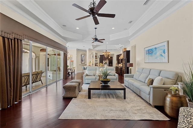 5909 Oxford Moor Blvd, Windermere, FL 34786 - living room with ceiling fan, crown molding, dark wood finished floors, a chandelier, and a tray ceiling
