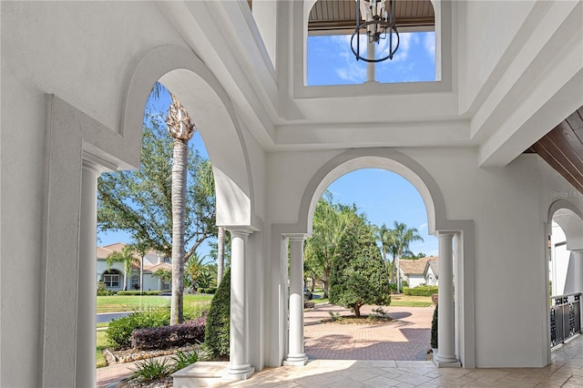 5909 Oxford Moor Blvd, Windermere, FL 34786 - entryway with a high ceiling, healthy amount of natural light, and a chandelier