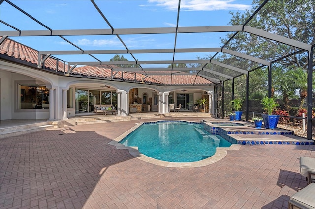 5909 Oxford Moor Blvd, Windermere, FL 34786 - view of pool featuring a patio, a ceiling fan, a pool with connected hot tub, and a lanai