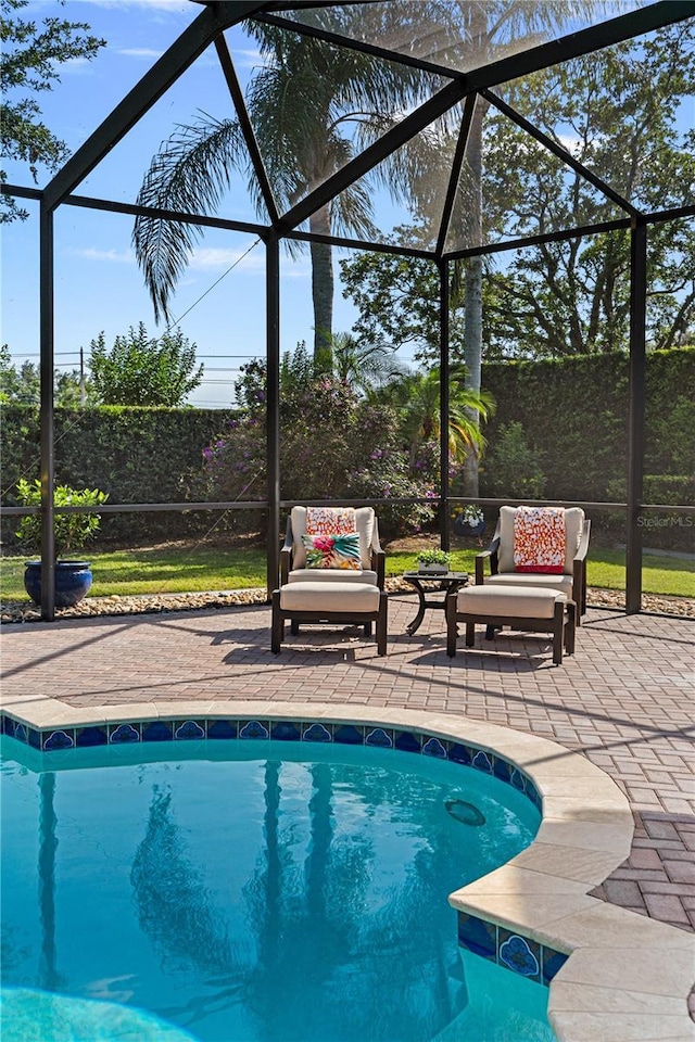5909 Oxford Moor Blvd, Windermere, FL 34786 - outdoor pool featuring a lanai and a patio area