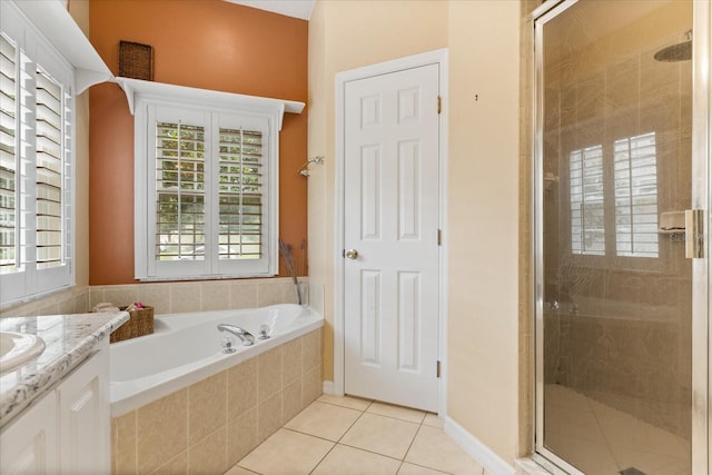 1428 Lucky Pennie Way, Apopka, FL 32712 - full bathroom with vanity, a stall shower, tile patterned floors, and a garden tub
