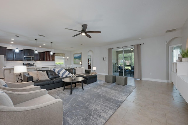 living area with ceiling fan, healthy amount of natural light, recessed lighting, baseboards, and light tile patterned floors