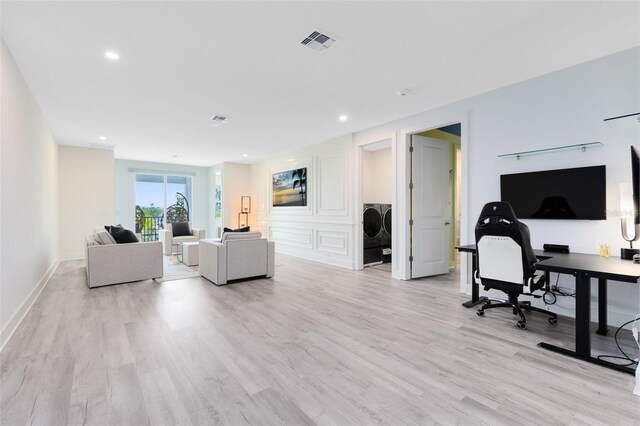 300 Muirfield Loop, Reunion, FL 34747 - living room featuring light wood-type flooring, a desk, recessed lighting, and baseboards