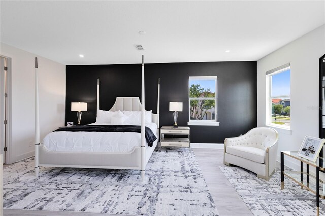 300 Muirfield Loop, Reunion, FL 34747 - bedroom with wood finished floors, recessed lighting, and baseboards
