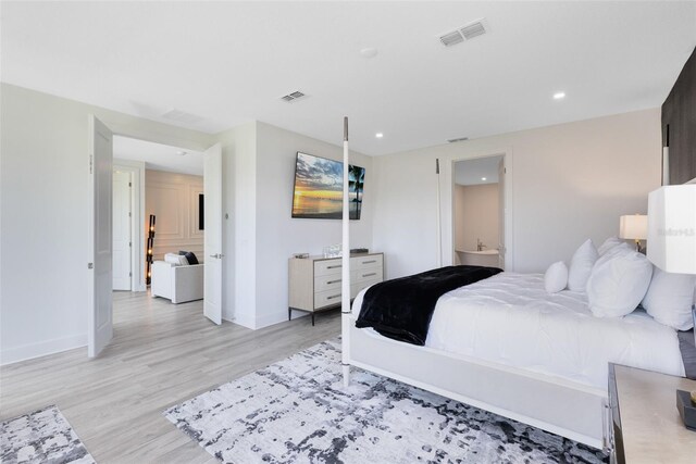 300 Muirfield Loop, Reunion, FL 34747 - bedroom featuring light wood-style floors, baseboards, and recessed lighting