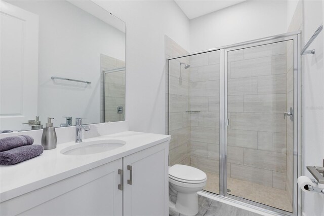 300 Muirfield Loop, Reunion, FL 34747 - full bath featuring a stall shower, toilet, and vanity
