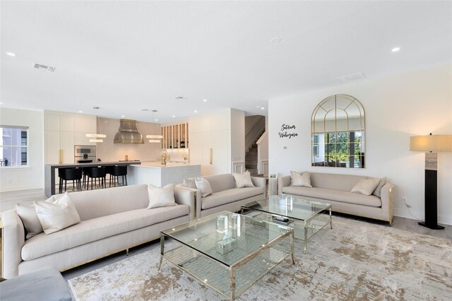 300 Muirfield Loop, Reunion, FL 34747 - living room featuring light wood-style flooring, baseboards, and recessed lighting
