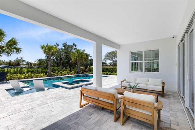 300 Muirfield Loop, Reunion, FL 34747 - view of swimming pool with a patio, a pool with connected hot tub, and an outdoor hangout area