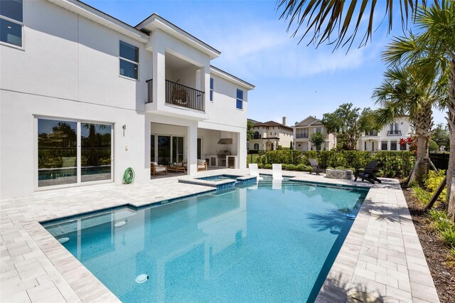 300 Muirfield Loop, Reunion, FL 34747 - view of swimming pool with a patio area and a pool with connected hot tub