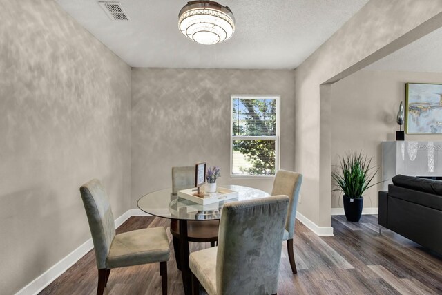 600 Bostwick Ave, Daytona Beach, FL 32118 - dining space featuring baseboards, visible vents, and wood finished floors