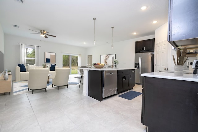 15998 SW 33rd Avenue Rd, Ocala, FL 34473 - kitchen with ceiling fan, open floor plan, light countertops, and appliances with stainless steel finishes