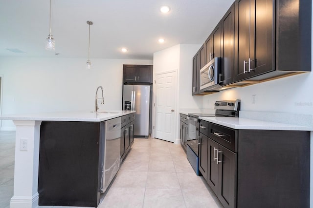 15998 SW 33rd Avenue Rd, Ocala, FL 34473 - kitchen featuring a sink, dark brown cabinetry, light countertops, hanging light fixtures, and appliances with stainless steel finishes