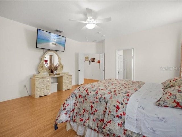 bedroom featuring wood finished floors and ceiling fan