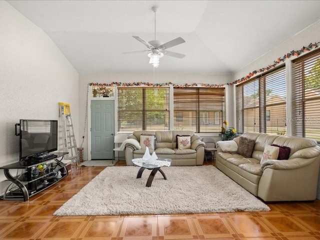living area with lofted ceiling and ceiling fan