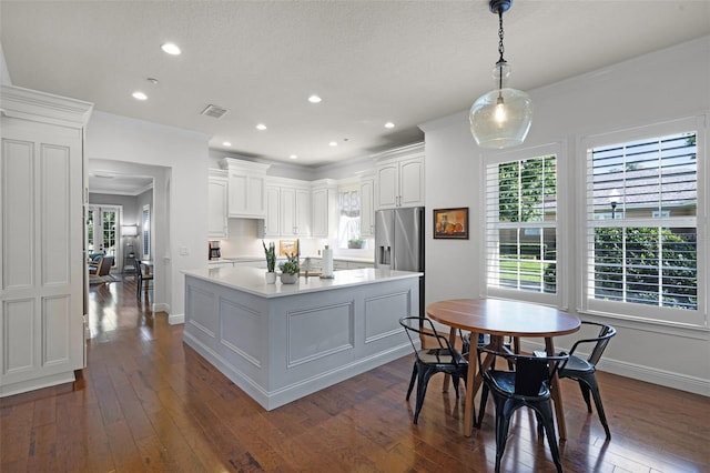 kitchen featuring stainless steel refrigerator with ice dispenser, baseboards, dark wood-type flooring, and recessed lighting