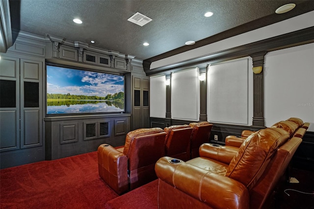 cinema with a decorative wall, a textured ceiling, recessed lighting, carpet flooring, and crown molding
