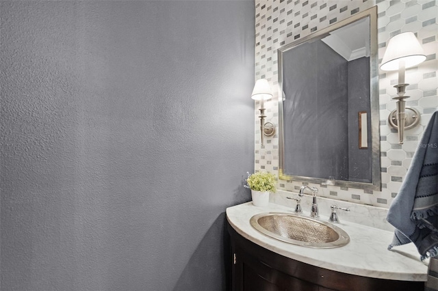 bathroom with backsplash and vanity