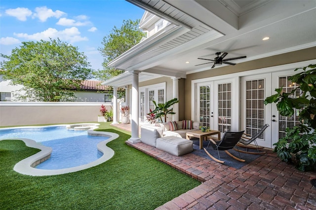 view of patio / terrace featuring french doors, fence, a ceiling fan, and a pool with connected hot tub