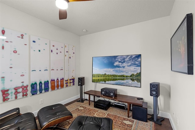 office space featuring a ceiling fan and baseboards