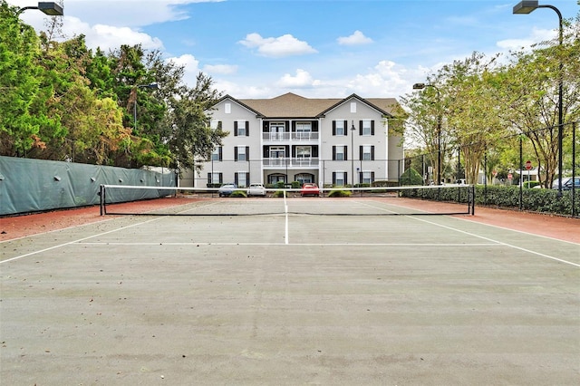 view of tennis court with fence